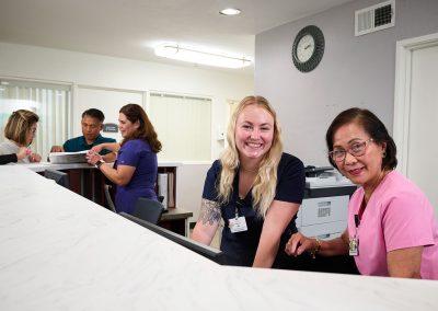 Some caregivers at the nurse's station in the Valle Vista facility