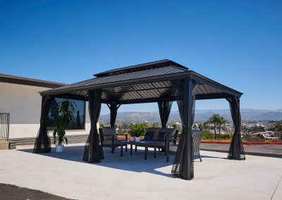 Covered soft seating in the back courtyard of the Valle Vista facility