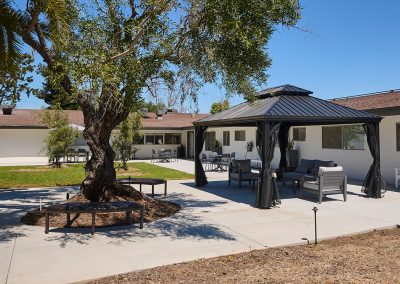 Covered soft seating in the back courtyard of the Valle Vista facility